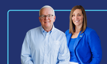 woman sitting in chair holding piggybank